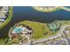 Aerial view of community amenities including pool, playground, and tennis courts at 9608 Ivory Dr, Ruskin, FL 33573