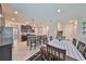 Dining room with table and chairs, open to kitchen and living room at 9608 Ivory Dr, Ruskin, FL 33573