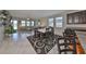 Open dining room with table and chairs, adjacent to living room at 9608 Ivory Dr, Ruskin, FL 33573