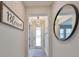 Entryway with a large mirror and a blessed sign at 9608 Ivory Dr, Ruskin, FL 33573
