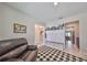 Entryway with a black leather couch and a view into the home at 9608 Ivory Dr, Ruskin, FL 33573