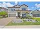 Two-story house with stone accents and a landscaped front yard at 9608 Ivory Dr, Ruskin, FL 33573