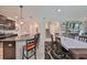 Open kitchen with island and granite countertops, view of dining area at 9608 Ivory Dr, Ruskin, FL 33573