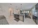 Open kitchen with island, stainless steel appliances, and granite countertops at 9608 Ivory Dr, Ruskin, FL 33573