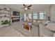 Spacious living room with stone fireplace and access to backyard at 9608 Ivory Dr, Ruskin, FL 33573