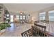 Spacious living room with sectional sofa, fireplace, and large windows at 9608 Ivory Dr, Ruskin, FL 33573