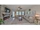 Spacious living room featuring a stone fireplace and large windows at 9608 Ivory Dr, Ruskin, FL 33573