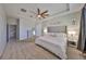 Spacious main bedroom with a king-size bed and neutral decor at 9608 Ivory Dr, Ruskin, FL 33573