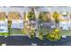 Aerial view of the property showcasing the home's layout, landscaping, and water access at 9665 2Nd N St, St Petersburg, FL 33702