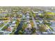 Aerial view highlighting homes along a canal, showcasing waterfront living and boat accessibility at 9665 2Nd N St, St Petersburg, FL 33702