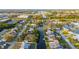 Scenic aerial view of waterfront homes along canals, showcasing lush landscaping and neighborhood layout at 9665 2Nd N St, St Petersburg, FL 33702