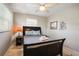 Bedroom featuring tiled floors, a decorative wall hanging, and warm bedside lighting at 9665 2Nd N St, St Petersburg, FL 33702