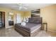 Bedroom featuring a queen bed, tile floors, ceiling fan, and decor at 9665 2Nd N St, St Petersburg, FL 33702