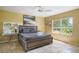 Bedroom with a queen bed, ceiling fan and natural light coming through a window at 9665 2Nd N St, St Petersburg, FL 33702