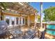 Outdoor wooden deck with a built-in cooking area and outdoor seating space at 9665 2Nd N St, St Petersburg, FL 33702