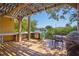 Spacious wooden deck featuring a built in cooking area and outdoor seating at 9665 2Nd N St, St Petersburg, FL 33702