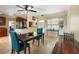 Dining room with travertine tile flooring and a view of kitchen with stainless steel appliances at 9665 2Nd N St, St Petersburg, FL 33702