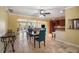 Bright dining room with a view of the kitchen and living area with tiled floor at 9665 2Nd N St, St Petersburg, FL 33702