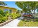 A paver path leads alongside the home to a convenient kayak storage area at 9665 2Nd N St, St Petersburg, FL 33702