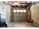 A spacious garage with a concrete floor and a gray sectional garage door at 9665 2Nd N St, St Petersburg, FL 33702