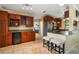Spacious kitchen features stone floors, stainless steel appliances and a large countertop with seating at 9665 2Nd N St, St Petersburg, FL 33702
