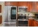 Kitchen showcasing modern appliances and dark wood cabinets at 9665 2Nd N St, St Petersburg, FL 33702