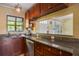 Kitchen featuring modern appliances and bar seating at 9665 2Nd N St, St Petersburg, FL 33702