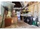 A practical laundry room with a washer, dryer, storage shelves, and utility sink at 9665 2Nd N St, St Petersburg, FL 33702