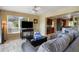 Open-concept living room with a large window, lots of sunlight, and access to the kitchen at 9665 2Nd N St, St Petersburg, FL 33702