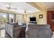 A cozy living room with lots of windows offering ample natural light and three ceiling fans at 9665 2Nd N St, St Petersburg, FL 33702