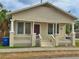 Tan Craftsman home with front porch and columns at 2001 N 25Th St, Tampa, FL 33605