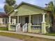 Light green Craftsman home with front porch and columns at 2001 N 25Th St, Tampa, FL 33605