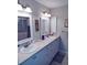 Double vanity bathroom with updated fixtures at 1000 Dunrobin Dr # C, Palm Harbor, FL 34684