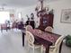 Bright dining room featuring a spacious table and elegant chandelier at 1000 Dunrobin Dr # C, Palm Harbor, FL 34684