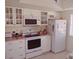 White kitchen with stainless steel appliances at 1000 Dunrobin Dr # C, Palm Harbor, FL 34684