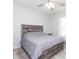 Main bedroom with a king-size bed and ceiling fan at 1024 Golden Shiner Ave, Ruskin, FL 33570