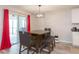 Dining area with wooden table and chairs, access to patio at 1024 Golden Shiner Ave, Ruskin, FL 33570