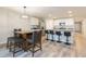 Kitchen with an island and a dining table with four chairs at 1024 Golden Shiner Ave, Ruskin, FL 33570