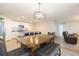 Dining area with wooden table and chairs, view of kitchen at 1024 Golden Shiner Ave, Ruskin, FL 33570