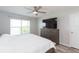 Spacious main bedroom with king bed and large dresser at 1024 Golden Shiner Ave, Ruskin, FL 33570