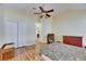 Bedroom with double closets and wood flooring at 10313 Lakeside Vista Dr, Riverview, FL 33569