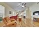 Bright living room with hardwood floors, neutral walls and comfortable furniture at 10313 Lakeside Vista Dr, Riverview, FL 33569