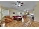 Living room with hardwood floors, open concept, and lots of natural light at 10313 Lakeside Vista Dr, Riverview, FL 33569