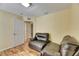 Sitting room with two leather chairs and wood floors at 10313 Lakeside Vista Dr, Riverview, FL 33569