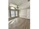 Bedroom with vaulted ceiling, wood-look floors, and fan at 10459 Fly Fishing St, Riverview, FL 33569