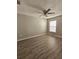 Bright bedroom with wood-look floors and ceiling fan at 10459 Fly Fishing St, Riverview, FL 33569