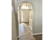 Bright entryway with an arched doorway and neutral color palette at 10459 Fly Fishing St, Riverview, FL 33569