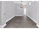 Bright dining room with gray walls and wood-look floors at 11441 Cypress Reserve Dr, Tampa, FL 33626