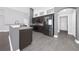 Modern kitchen with dark brown cabinets and granite countertops at 11441 Cypress Reserve Dr, Tampa, FL 33626