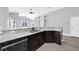 Modern kitchen island with granite countertops and sink at 11441 Cypress Reserve Dr, Tampa, FL 33626